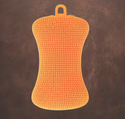 Eponge orange en silicone sur fond marron