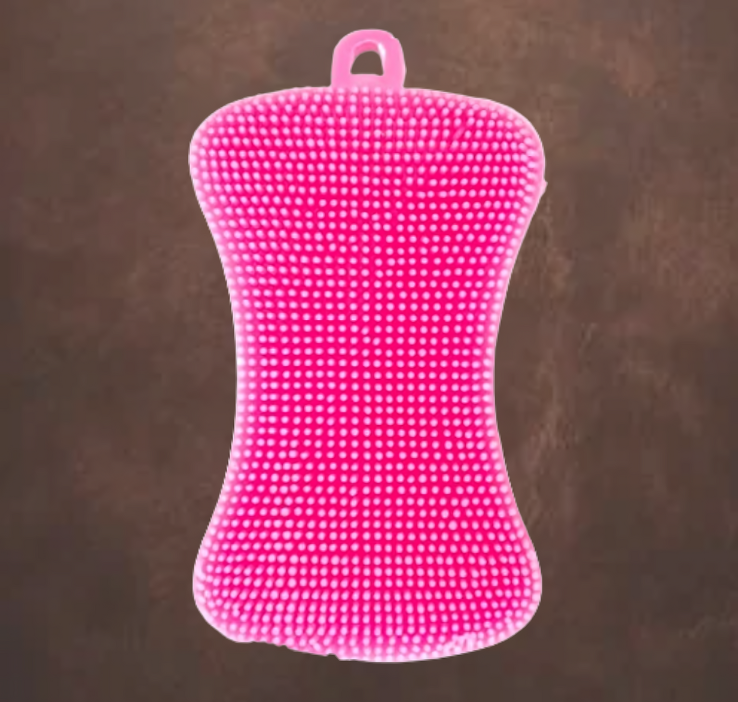 Eponge rose en silicone sur fond marron